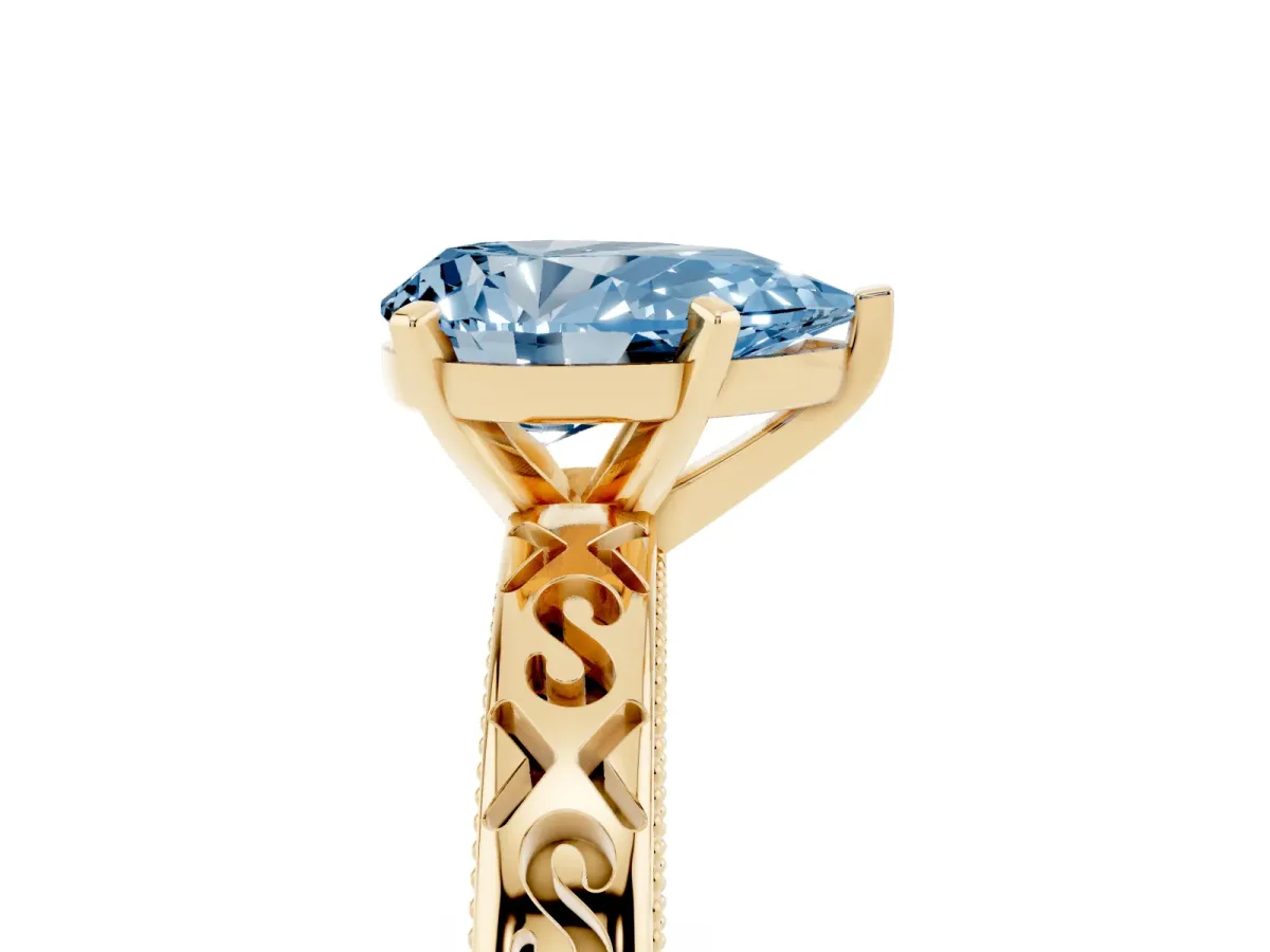 Fancy Blue Pear Cut Solitaire Engagement Ring with Scrollwork Band and Four-Prong Setting Yellow gold