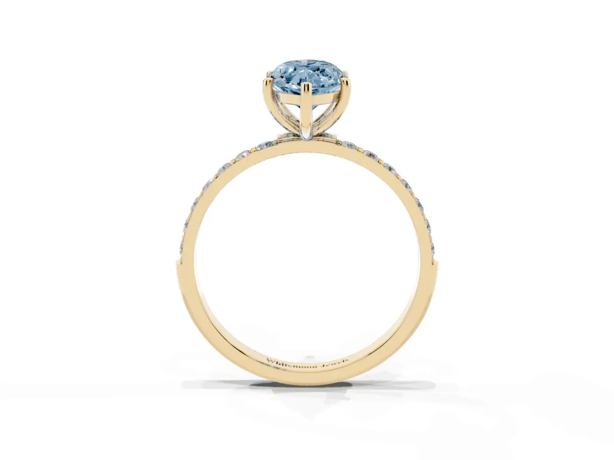 Fancy Blue Marquise Cut Diamond Solitaire Ring with Round Pavé Shoulders and Prong Setting Yellow gold