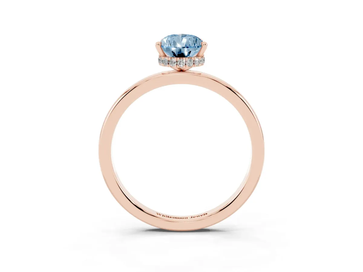 Fancy Blue Pear Cut Solitaire Engagement Ring with Cathedral Band and Four-Prong Setting Rose gold