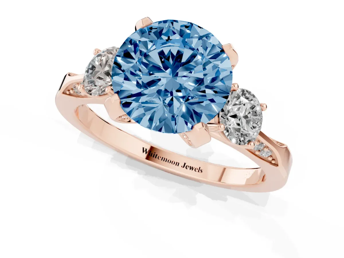 Fancy Blue Round Cut Brilliant Three-Stone Diamond Ring with Pavé Band and Four-Prong Setting Rose gold