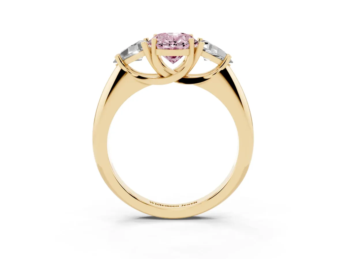 Fancy Pink Three-Stone Oval Cut Diamond Engagement Ring with Trillion Side Stones and Prong Setting Yellow gold