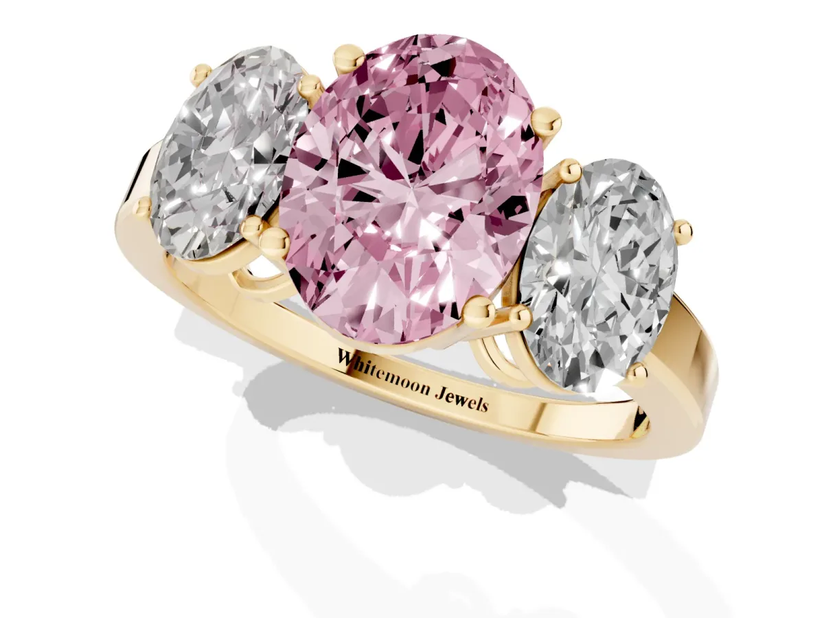 Fancy Pink Three-Stone Oval Cut Cut Diamond Engagement Ring with Flat Band and Four-Prong Setting Yellow gold