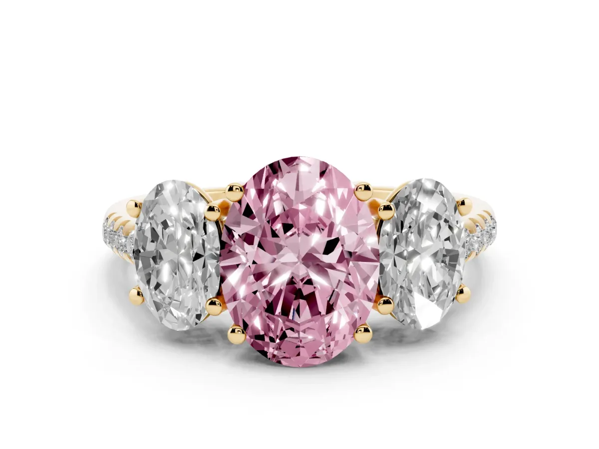 Fancy Pink Three-Stone Oval Cut Diamond Ring with Round Pavé Band and Prong Setting Yellow gold