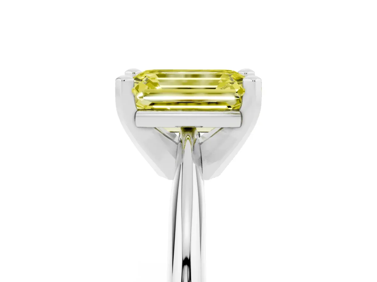 Fancy Yellow Emerald Cut Cut Solitaire Ring with Four-Prong Setting on a Classic Band Silver