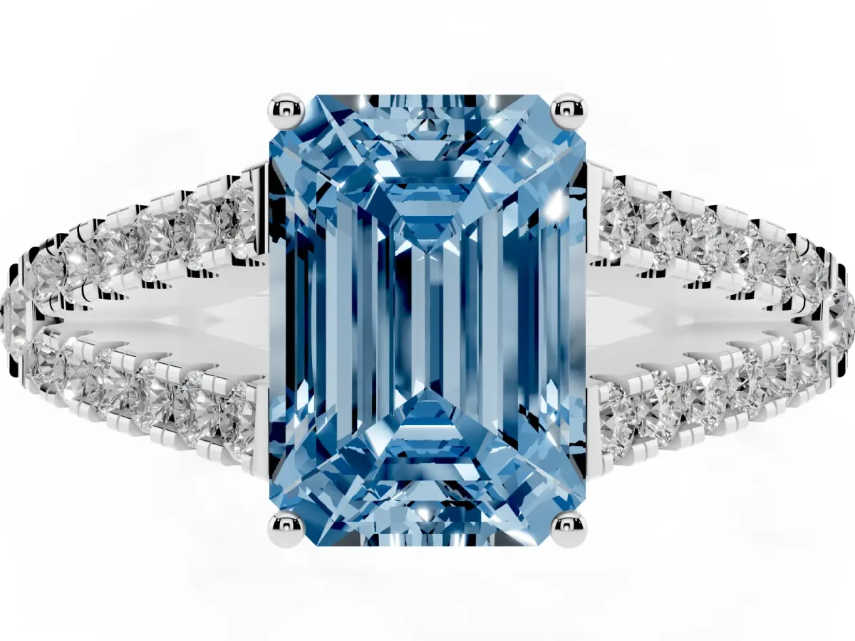 Fancy Blue Emerald Cut Diamond Split Shank Pavé Engagement Ring with Four-Prong Setting Silver