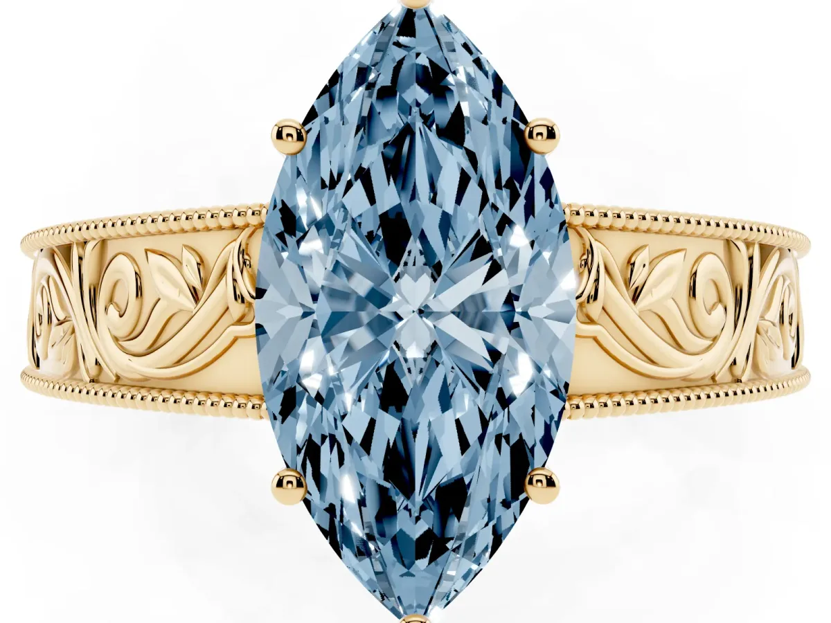 Fancy Blue Marquise Cut Diamond Solitaire Ring with Engraved Band and Four-Prong Setting Yellow gold
