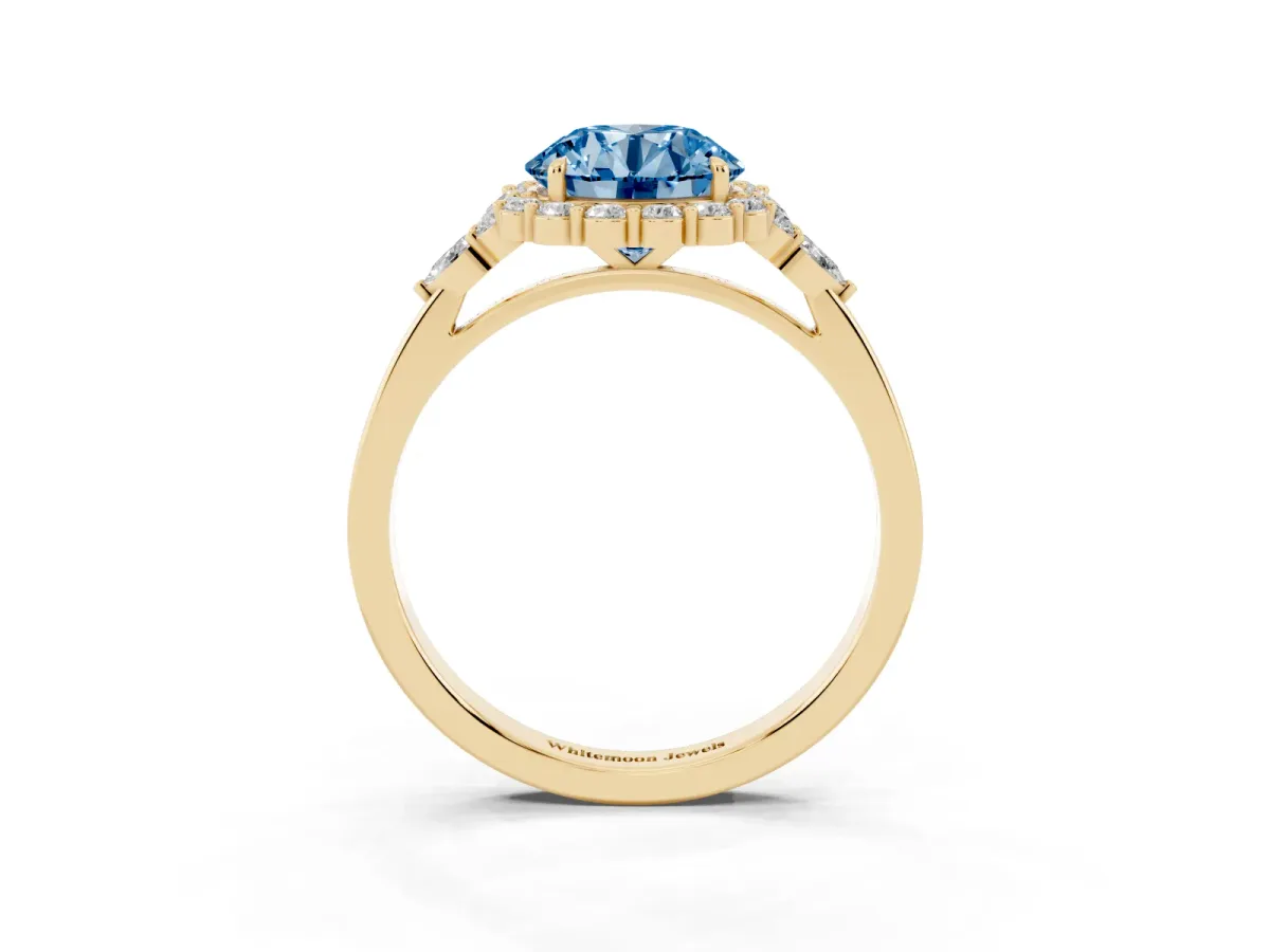 Fancy Blue Round Cut Diamond Halo Ring with Pear Side Stones and Prong Setting Yellow gold
