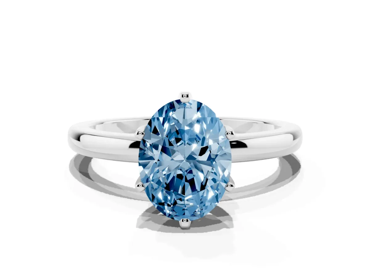 Fancy Blue Oval Cut Solitaire Diamond Ring with Six-Prong Setting on a Classic Band Silver