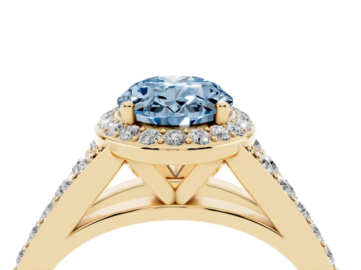 Fancy Blue Oval Cut Diamond Split Shank Halo Ring with Four-Prong Setting Yellow gold