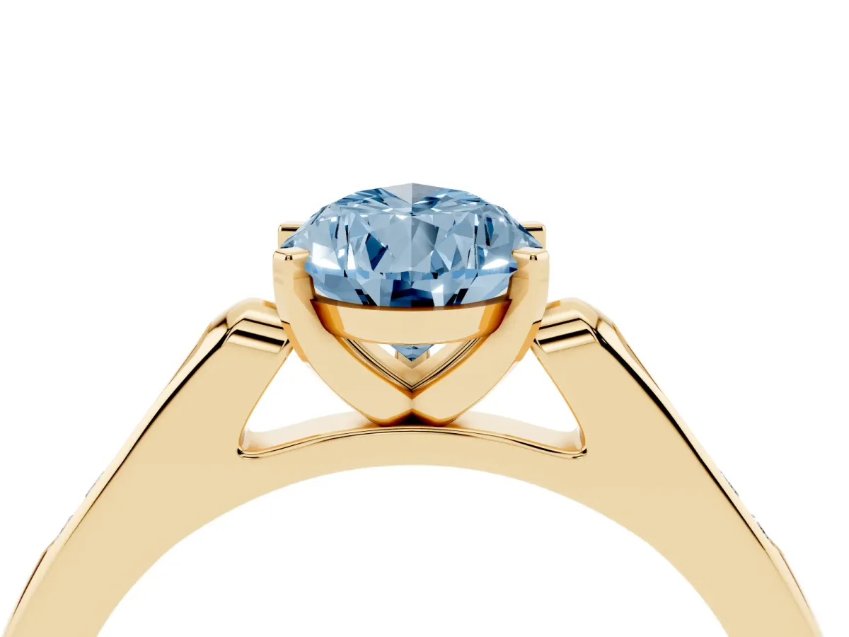 Fancy Blue Pear Cut Diamond Solitaire Ring with Channel Set Round Band and Prong Setting Yellow gold