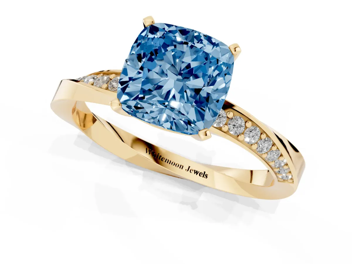 Fancy Blue Cushion Cut Diamond Engagement Ring with Side Stone Accents and Four-Prong Setting Yellow gold
