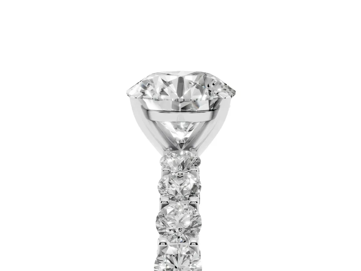 Round Cut Diamond Solitaire Ring with Shared Prong Pavé Band and Four-Prong Setting Silver