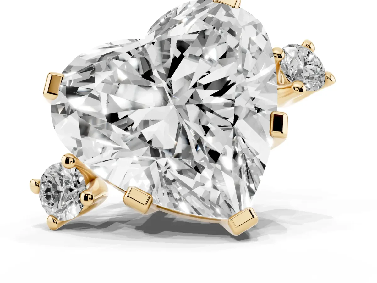 Heart Cut Cut Three-Stone Solitaire Ring with Round Accent Diamonds and Four-Prong Setting Yellow gold