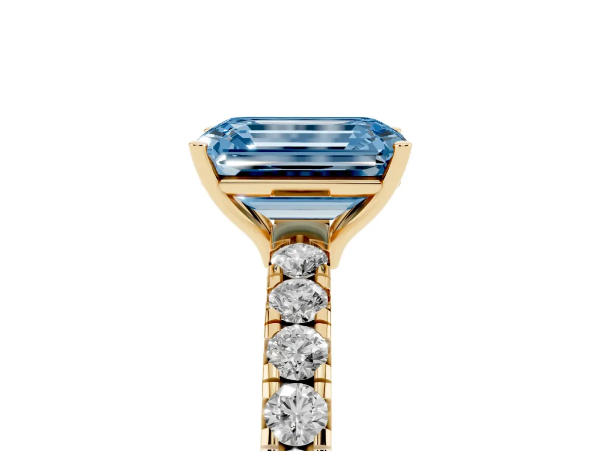 Fancy Blue Emerald Cut Diamond Pavé Solitaire Engagement Ring with Four-Prong Setting Yellow gold