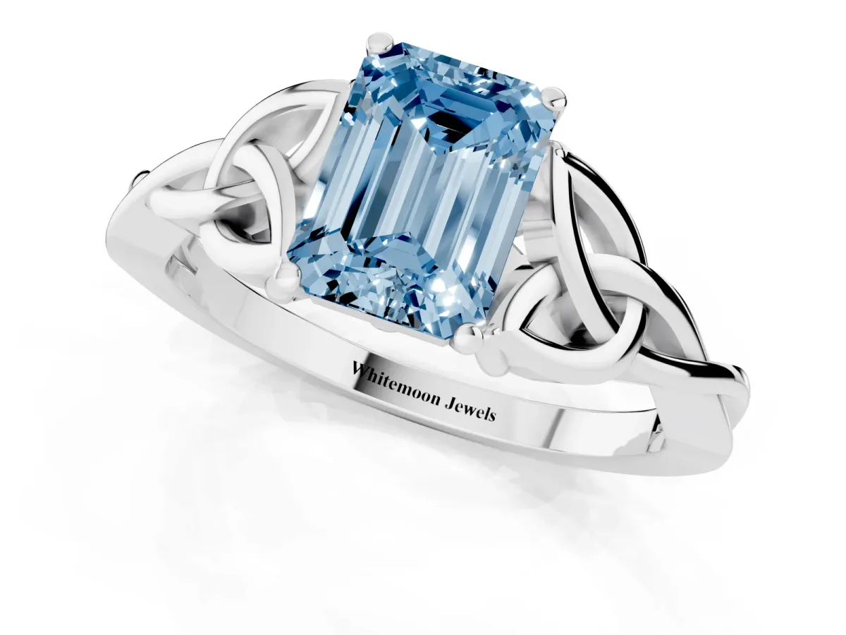 Fancy Blue Emerald Cut Diamond Solitaire Engagement Ring with Celtic Knot Band and Four-Prong Setting Platinum