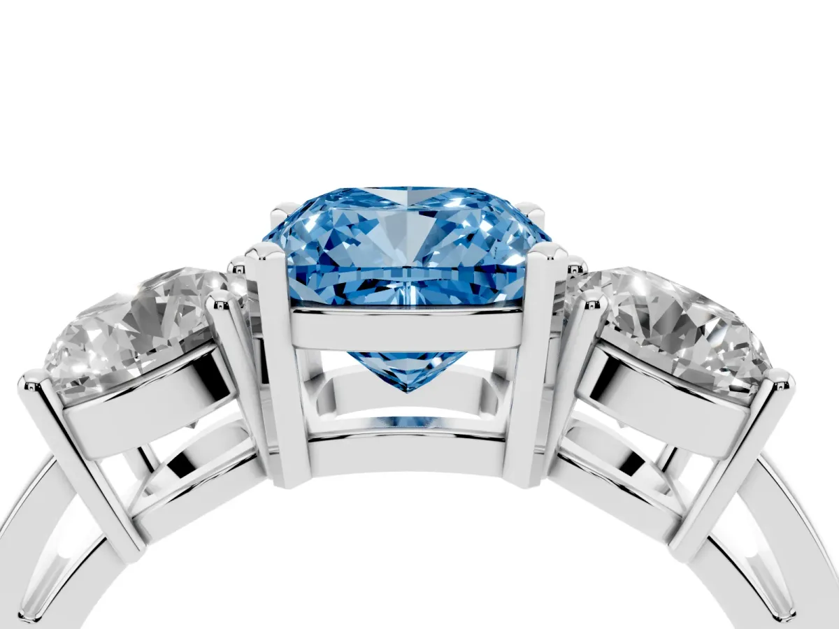 Fancy Blue Three-Stone Cushion Cut Diamond Ring with Round Side Stones, Classic Band, and Four-Prong Setting White gold