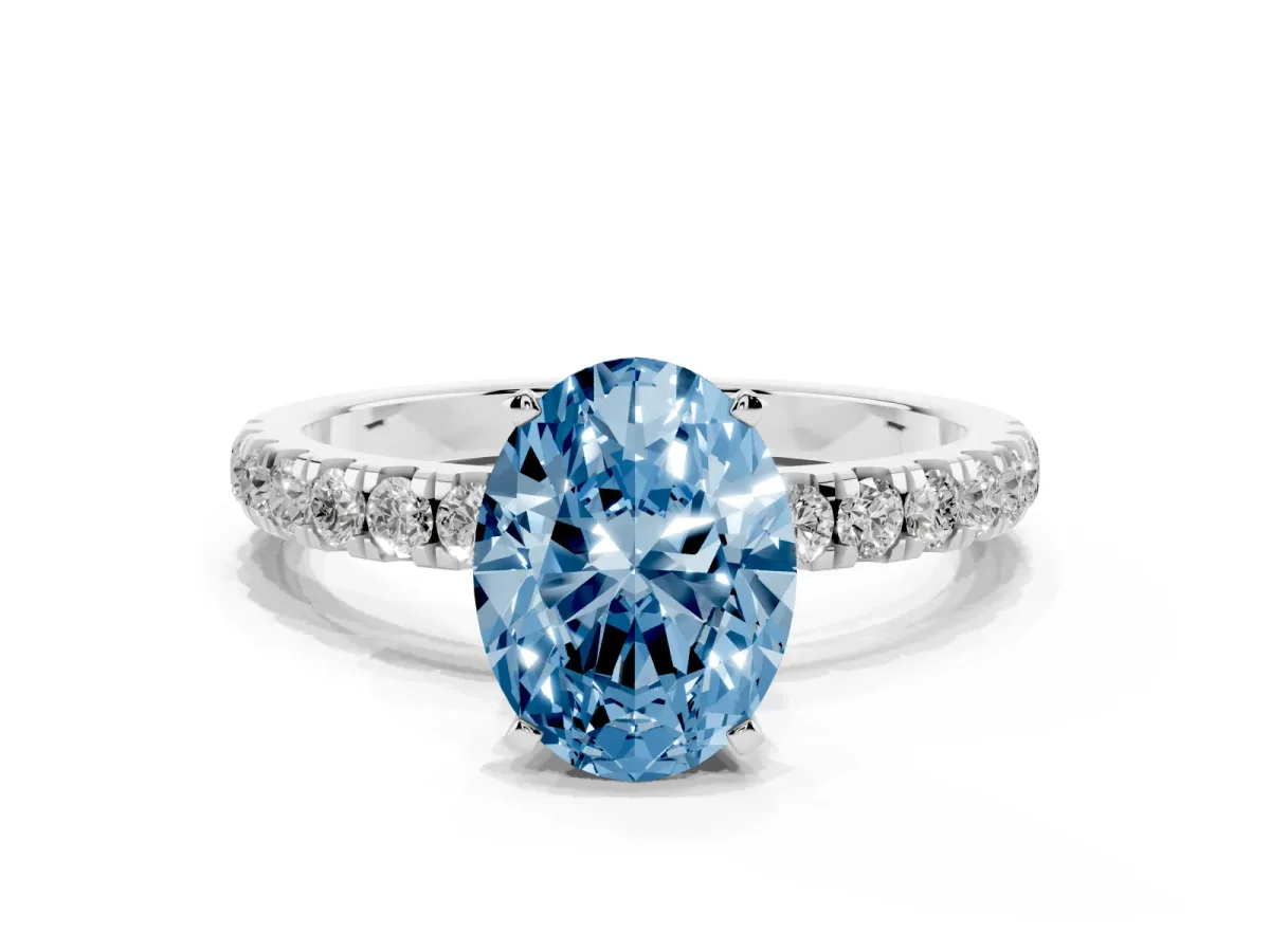 Fancy Blue Oval Cut Diamond Solitaire Ring with Pavé Accents and Four-Prong Setting Silver