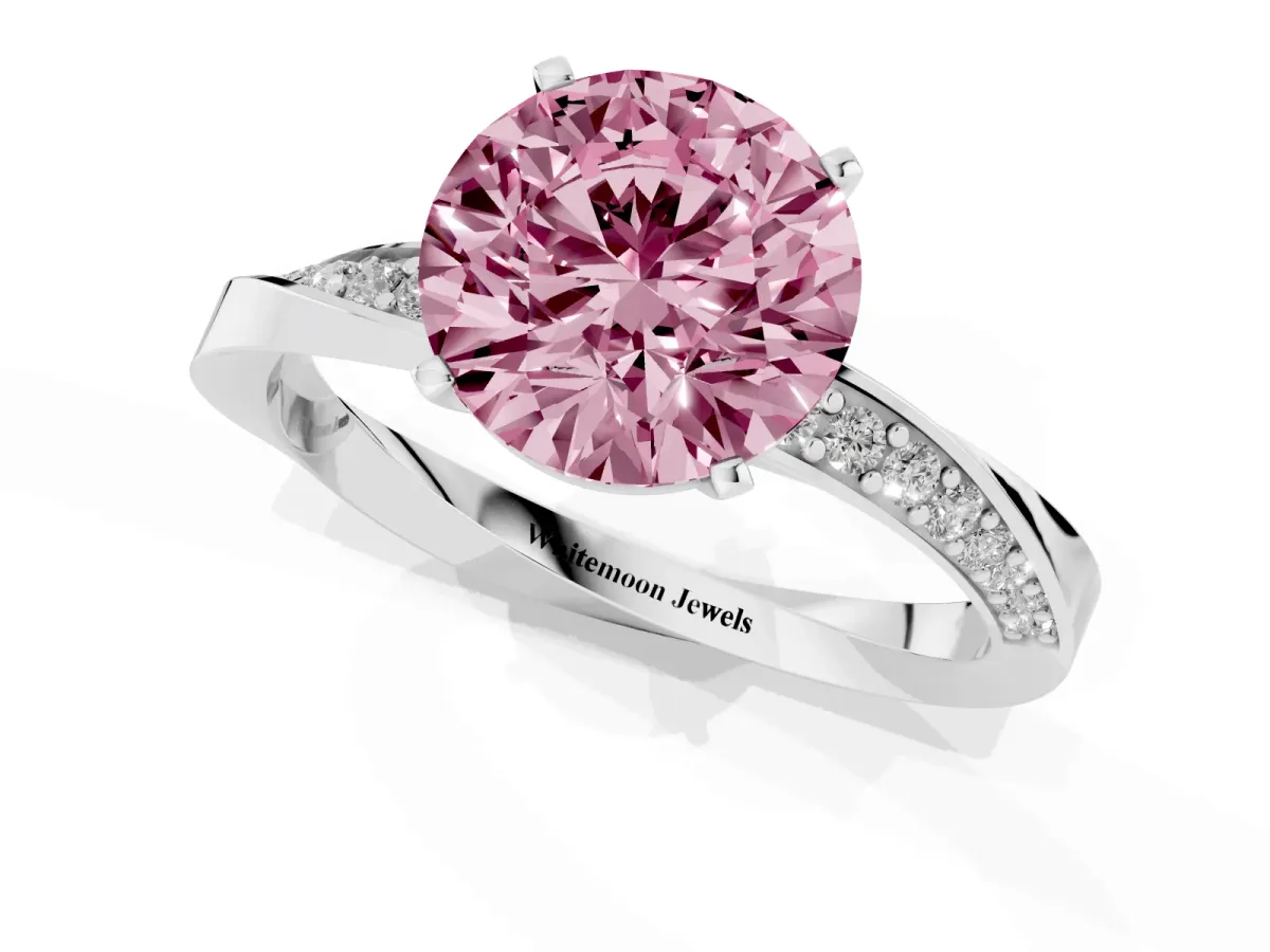 Fancy Pink Round Cut Diamond Engagement Ring with Side Stone Accents and Four-Prong Setting Silver