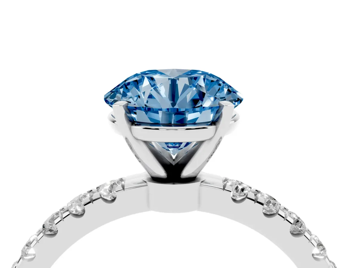 Fancy Blue Round Cut Diamond Solitaire Ring with Pavé Accents and Four-Prong Setting Platinum