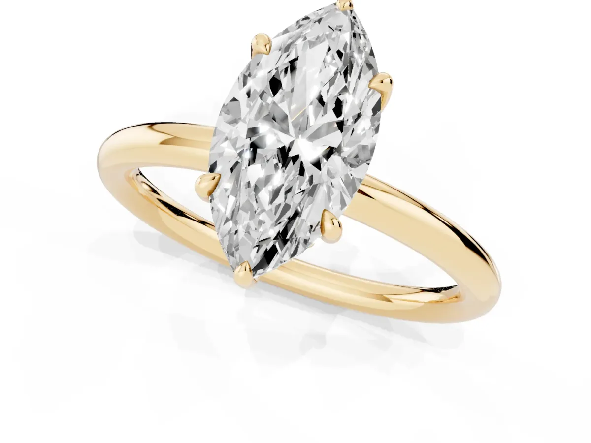 Marquise Cut Diamond Solitaire Ring with Thin Band and Four-Prong Setting Yellow gold
