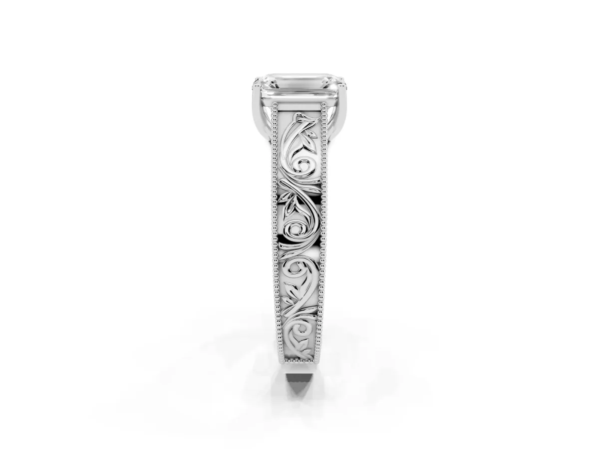 Emerald Cut Diamond Solitaire Ring with Engraved Band and Four-Prong Setting Platinum