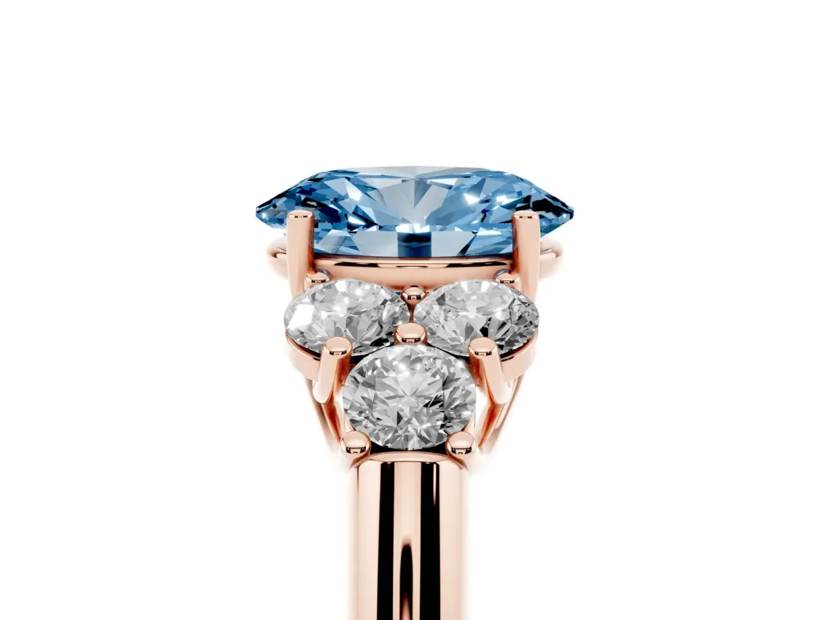 Fancy Blue Oval Cut Cut Diamond Cluster Ring with Round Accent Stones and Prong Setting on a Classic Band Rose gold