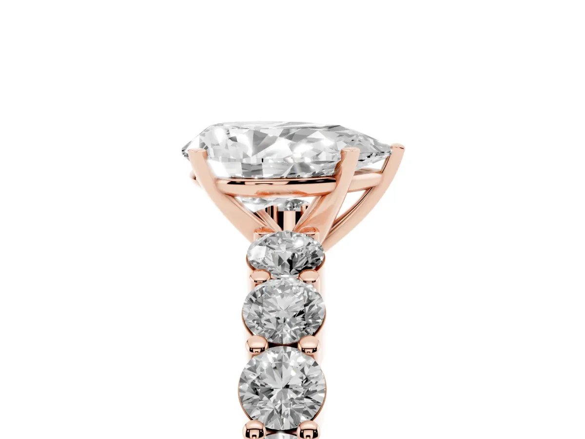 Pear Cut Diamond Solitaire Ring with Shared Prong Round Side Stones Rose gold
