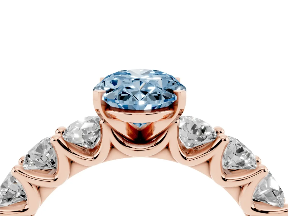 Fancy Blue Oval Cut Diamond Prong Setting with Side Stones on a Pave Band Rose gold