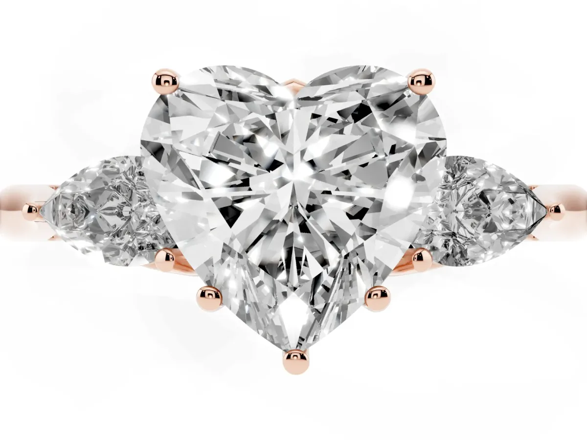 Three-Stone Heart Cut Diamond Ring with Pear Side Stones in Four-Prong Setting Rose gold