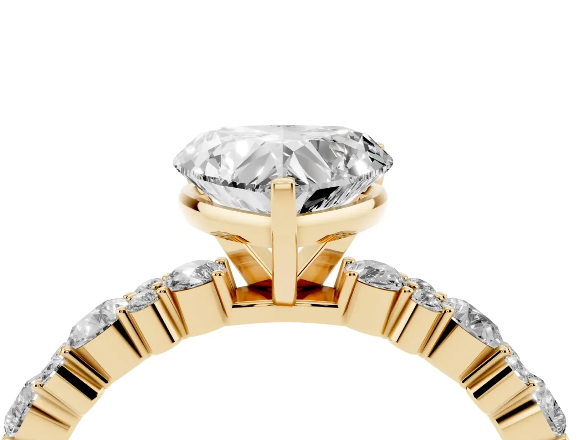 Heart Cut Diamond Side Stone Solitaire Ring with Round and Four-Prong Setting Yellow gold