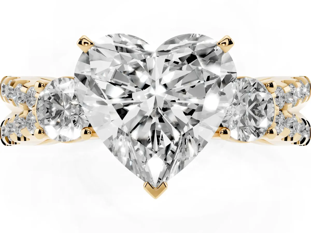Heart Cut Diamond Three-Stone Ring with Pavé Split Shank and Four-Prong Setting Yellow gold