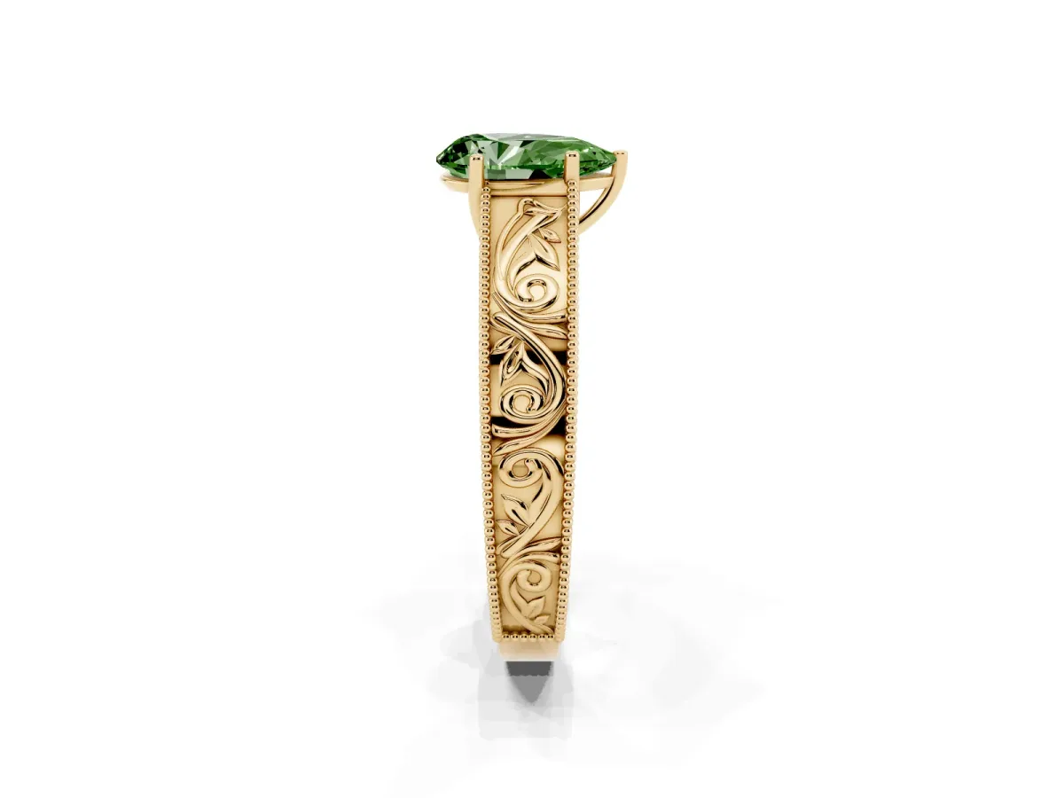 Fancy Green Pear Cut Diamond Solitaire Ring with Engraved Band and Four-Prong Setting Yellow gold