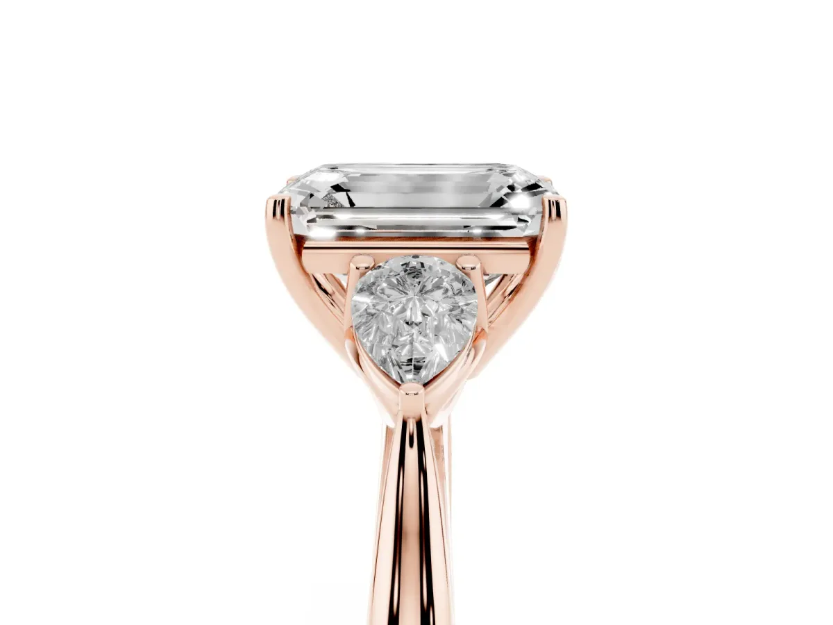 Three-Stone Emerald Cut Brilliant Diamond Solitaire Ring with Tapered Band and Four-Prong Setting Rose gold