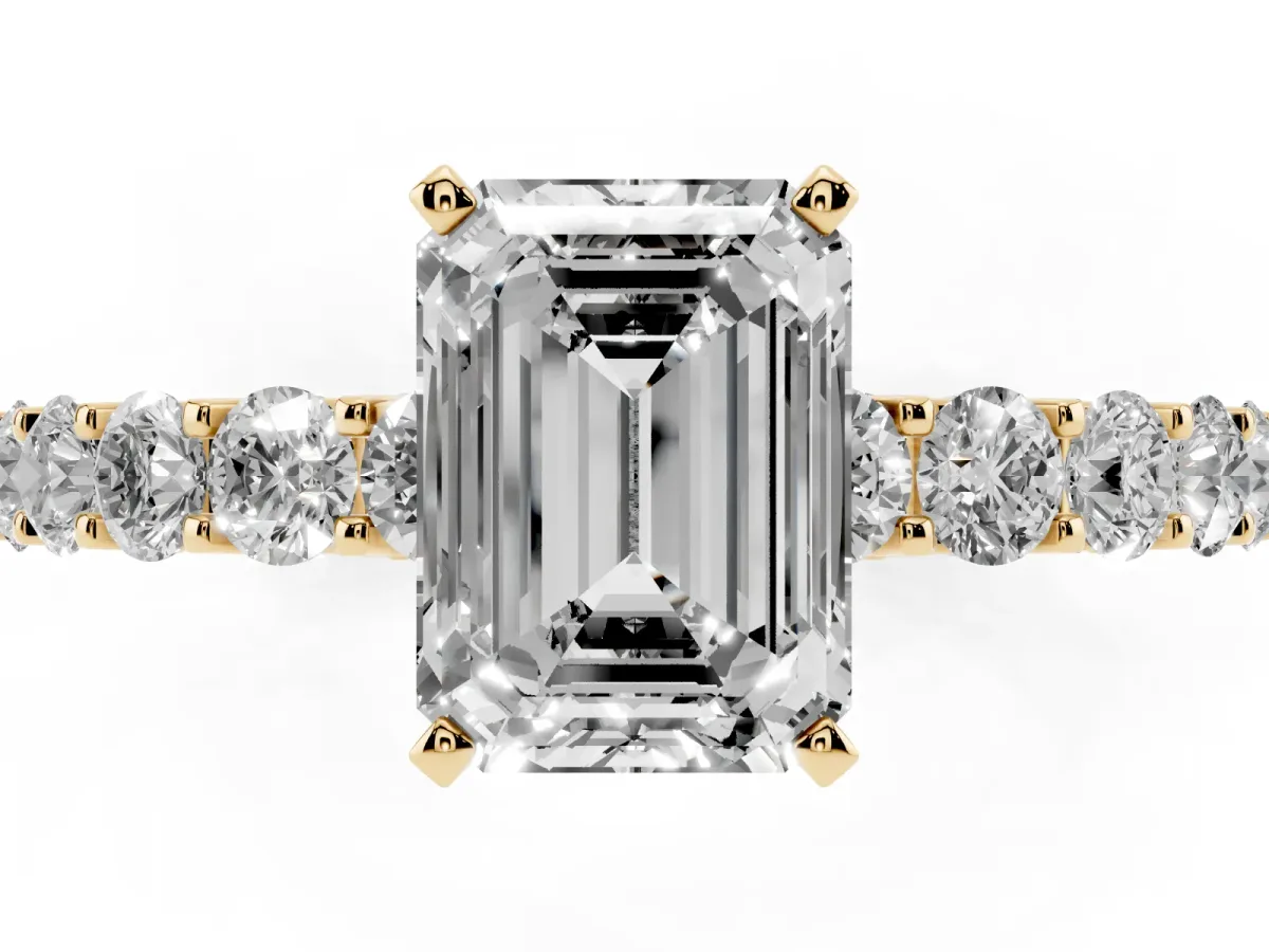 Emerald Cut Diamond Solitaire Ring with Shared Prong Pavé Band and Four-Prong Setting Yellow gold