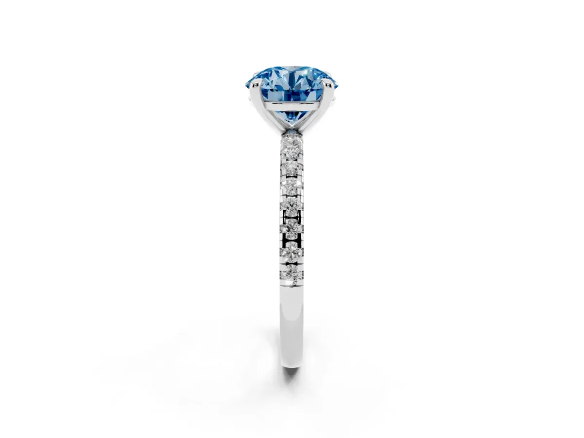 Fancy Blue Round Cut Diamond Brilliant Solitaire Ring with Pavé Band and Four-Prong Setting Platinum