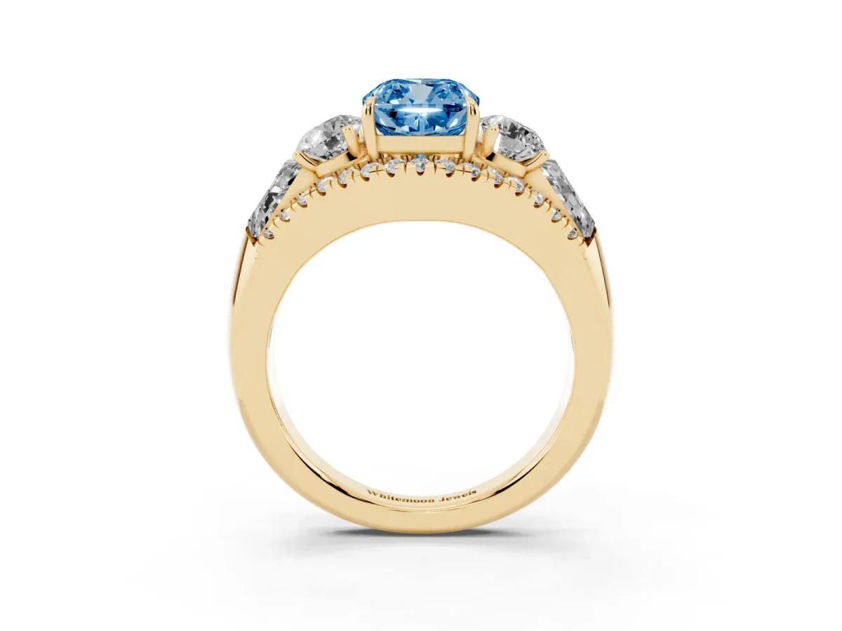Fancy Blue Three-Stone Cushion Cut Diamond Engagement Ring with Pave Band and Prong Setting Yellow gold