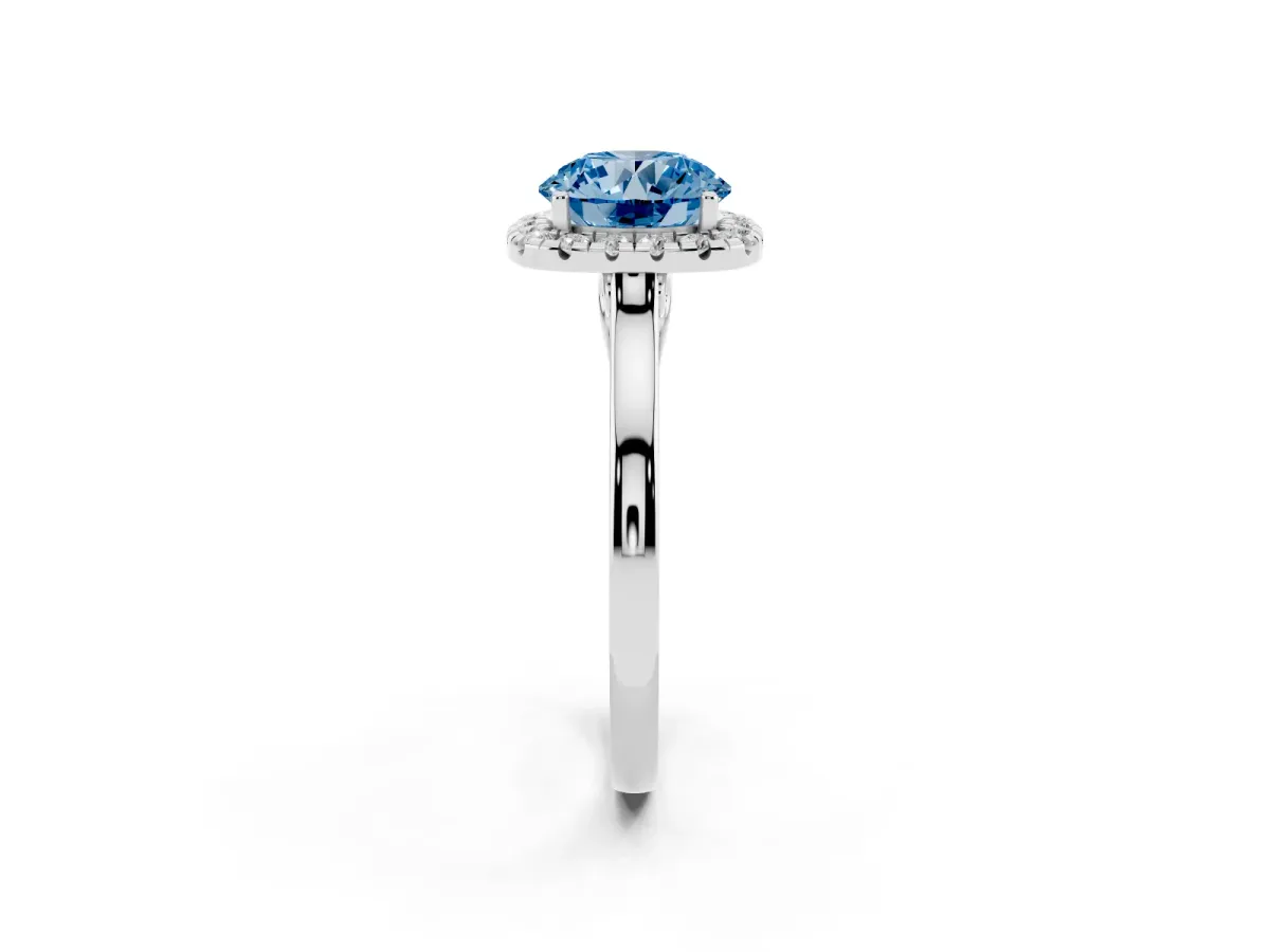 Fancy Blue Round Cut Halo Round Diamond Solitaire Ring with Pavé Band and Four-Prong Setting Silver