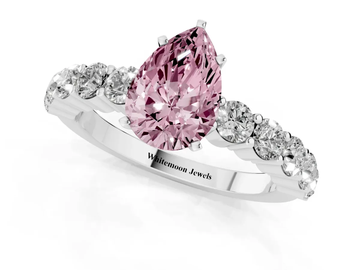 Fancy Pink Pear Cut Diamond Solitaire Ring with Shared Prong Round Side Stones White gold