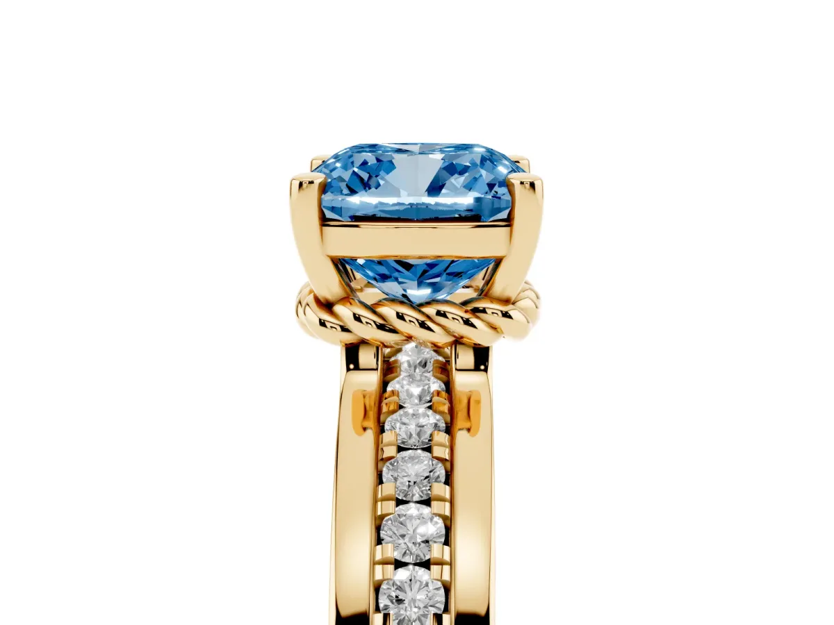 Fancy Blue Cushion Cut Solitaire Diamond Ring with Channel Set Band and Six-Prong Setting Yellow gold