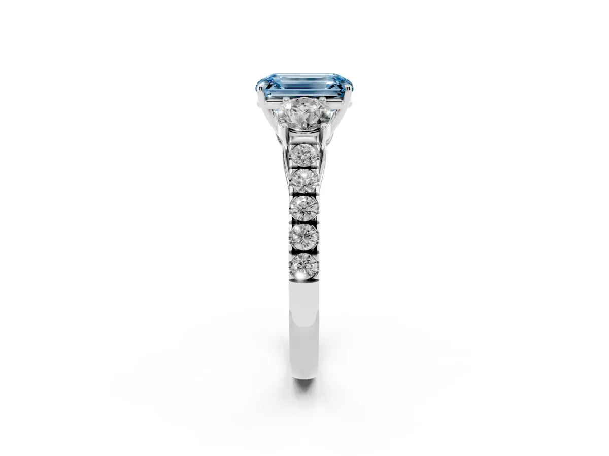 Fancy Blue Emerald Cut Cut Diamond Three-Stone Ring with Round Side Stones and Pavé Band Silver