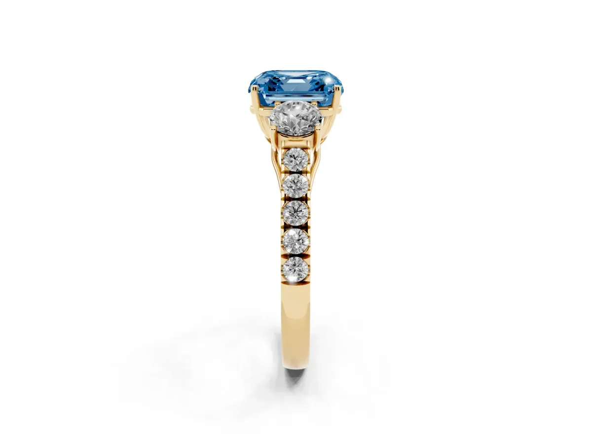 Fancy Blue Asscher Cut Cut Diamond Three-Stone Ring with Round Side Stones and Pavé Band Yellow gold