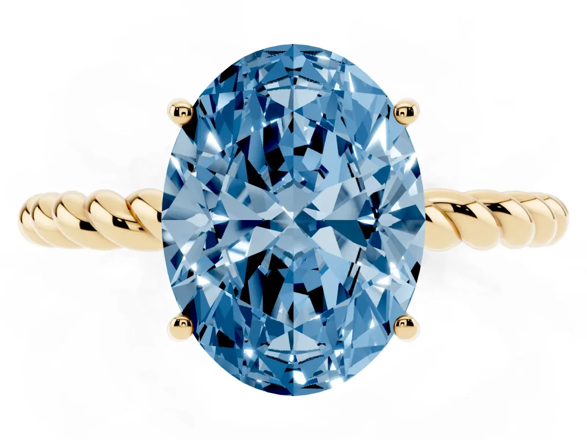 Fancy Blue Oval Cut Solitaire Twist Band Ring with Four-Prong Setting Yellow gold