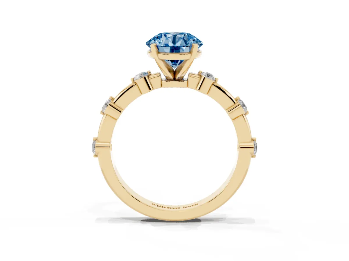 Fancy Blue Round Cut Solitaire Diamond Ring with Bezel Set Side Stones and Prong Setting Yellow gold