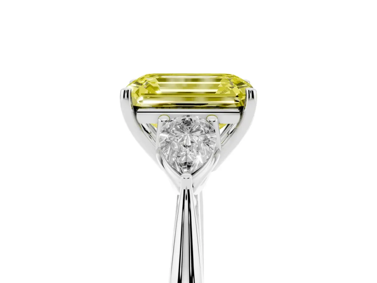 Fancy Yellow Three-Stone Emerald Cut Diamond Ring with Pear Side Stones in Four-Prong Setting Silver