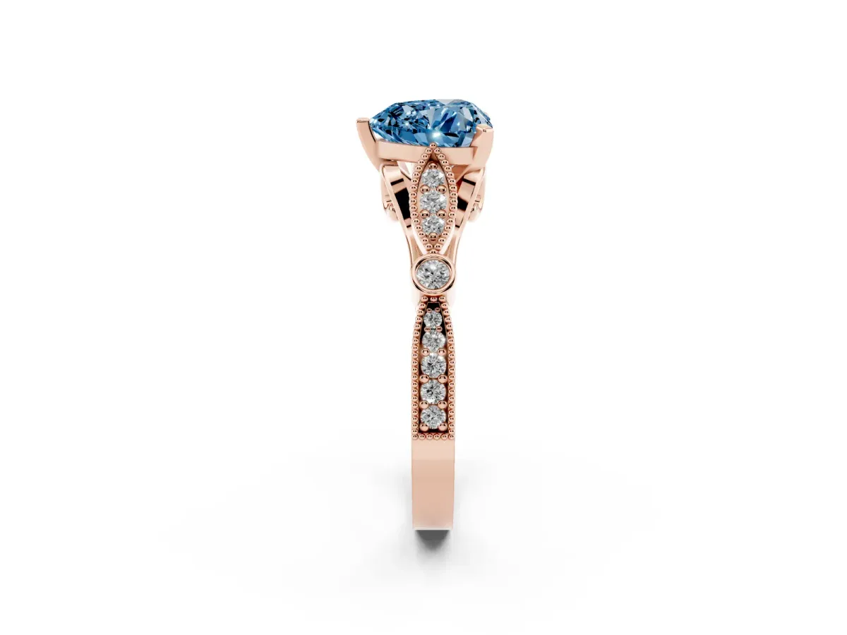 Fancy Blue Heart Cut Cut Diamond with Milgrain Marquise and Bezel Accents on a Solitaire Band with Prong Setting Rose gold