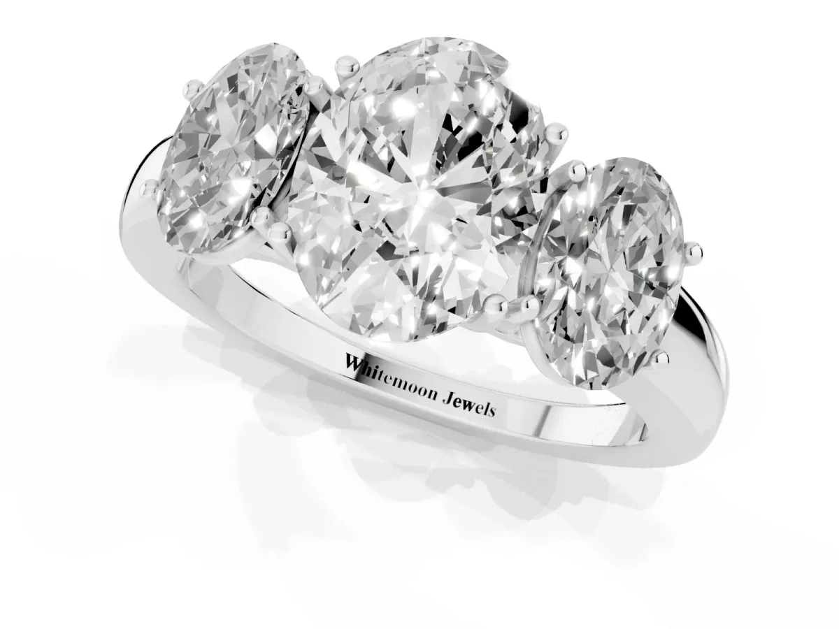 Oval Cut Diamond Three-Stone Ring with Four-Prong Setting and Classic Band Platinum
