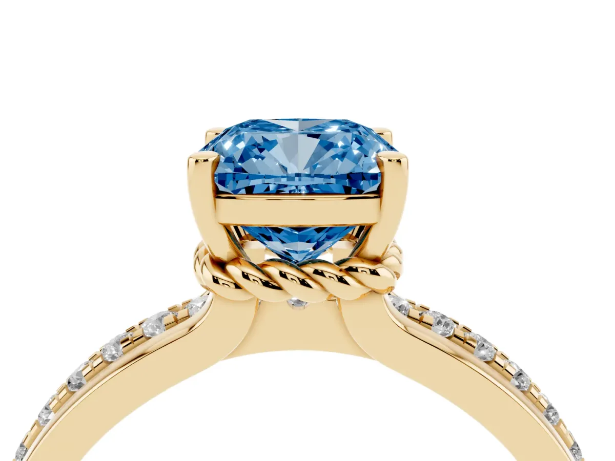 Fancy Blue Cushion Cut Solitaire Diamond Ring with Channel Set Band and Six-Prong Setting Yellow gold