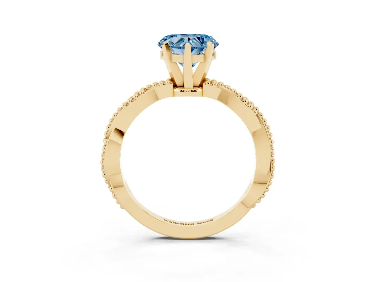 Fancy Blue Heart Cut Solitaire Twisted Band with Bead Prong Setting Yellow gold