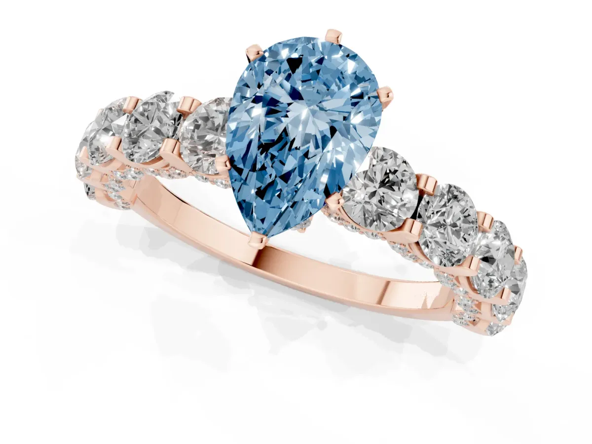 Fancy Blue Pear Cut Diamond Side Stone Engagement Ring with Four-Prong Setting Rose gold