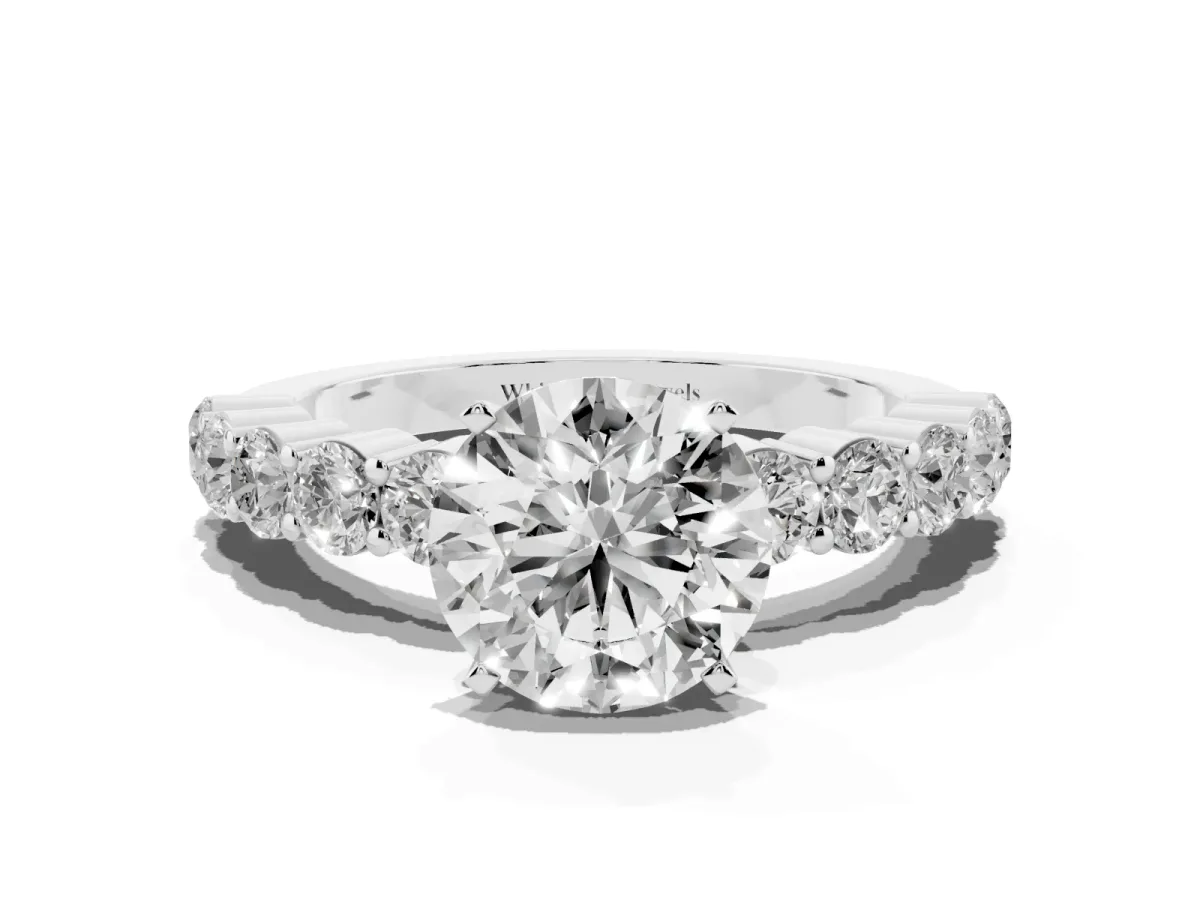 Round Cut Diamond Solitaire Ring with Shared Prong Round Side Stones Silver
